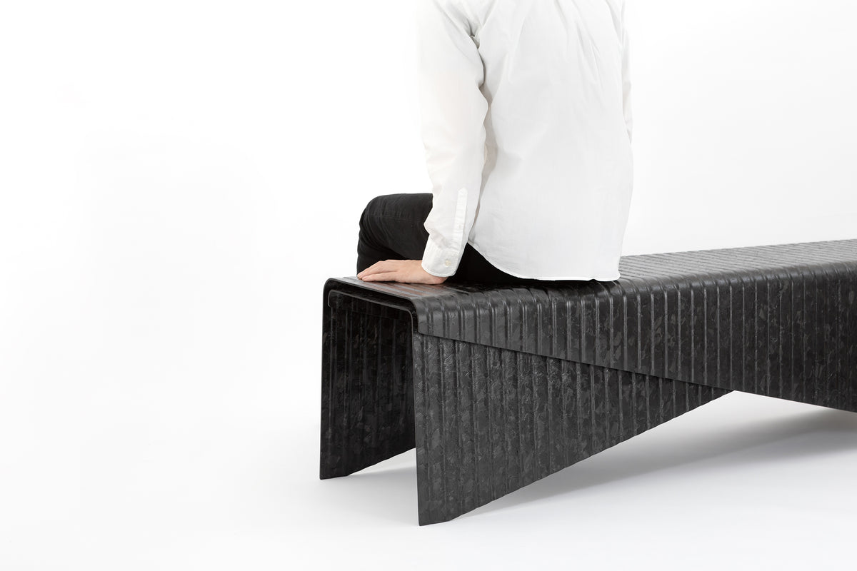 Black colored bench made out of TAFNEX CF-PP Design sheets using thermoforming process. 